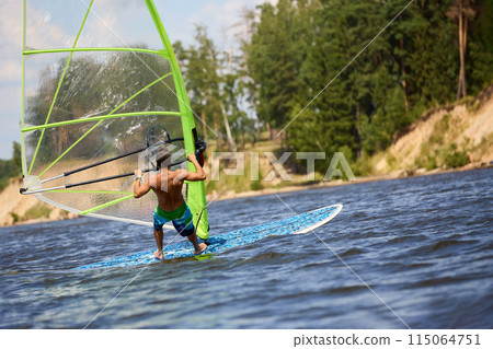 Windsurfer passing by 115064751