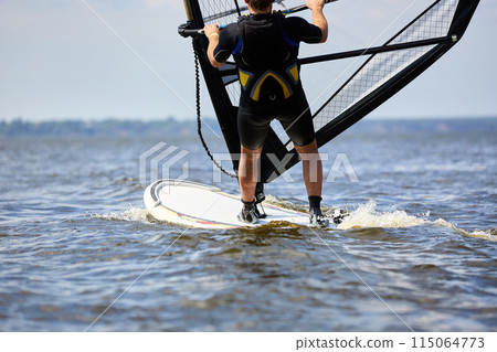 Windsurfer passing by 115064773