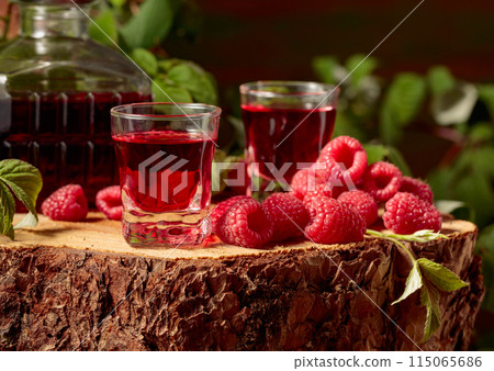 Raspberry liquor and fresh berries. Raspberry liquor and fresh berries. 115065686