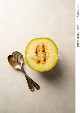 Cantaloupe, melon fruit slice over bright background.  Cantaloupe, melon fruit slice over bright background.  115066079