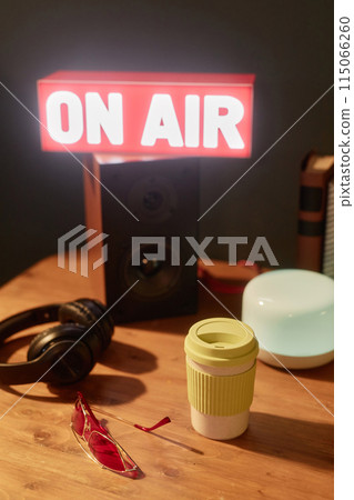 Vertical background image of light up On air sign in studio with speakers and podcast equipment Vertical background image of light up On air sign in studio with speakers and podcast equipment 115066260