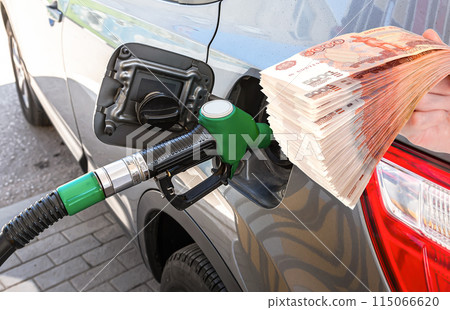Fuel nozzle to release fuel into passenger car at the gas station 115066620