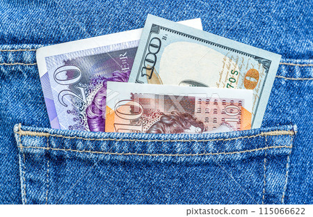 British pounds sterling and American dollars in the back jeans pocket British pounds sterling and American dollars in the back jeans pocket 115066622