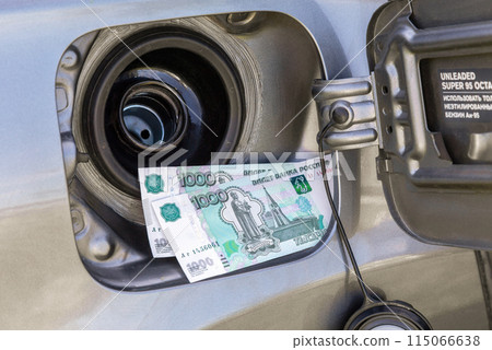 Russian rubles banknotes in the gas tank of a vehicle Russian rubles banknotes in the gas tank of a vehicle 115066638