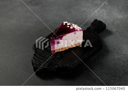 Blueberry cheesecake. On a black background 115067040