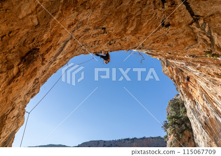 Man is climbing, training in the mountains. Man is climbing, training in the mountains. 115067709