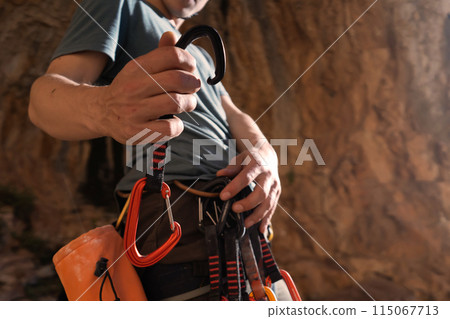 Man is climbing, hiking in the mountains. 115067713