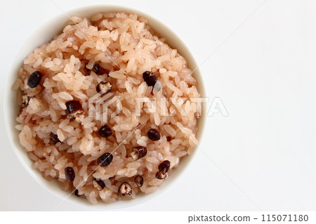 Red rice served in a bowl on a white background Red rice served in a bowl on a white background 115071180