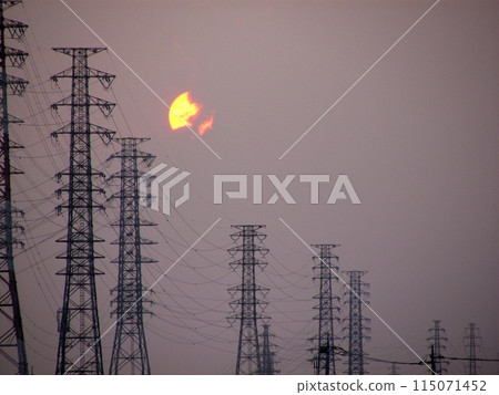 The afternoon sun hugs several electricity transmission towers (July 2015) and the July clouds take on strange shapes. The afternoon sun hugs several electricity transmission towers (July 2015) and the July clouds take on strange shapes. 115071452