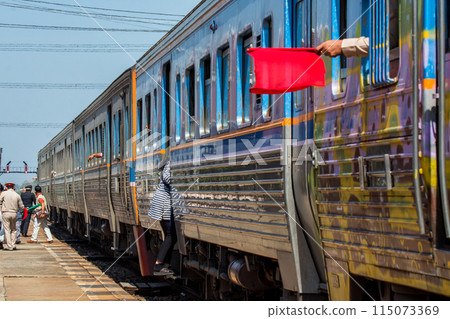 People get up and down the train while it's stopped. People get up and down the train while it's stopped. 115073369