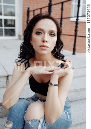 Close up portrait of a sensitive woman looking at the camera.  115073696