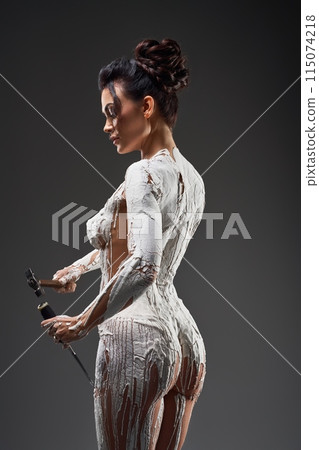 Nude self made woman statue in gray studio Nude self made woman statue in gray studio 115074218