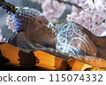 Nirvana white marble reclining Buddha, beautiful flower background. 115074332