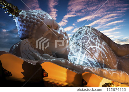 Nirvana white marble reclining Buddha, beautiful sky background. 115074333