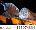 Nirvana white marble reclining Buddha, beautiful, black background. 115074334