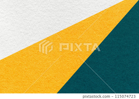 Texture of old craft white, yellow and emerald color paper background, macro. Vintage abstract teal cardboard 115074723