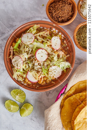 Pozole rojo, Mexican corn soup, traditional food in Mexico made with corn kernels and pork. Pozole rojo, Mexican corn soup, traditional food in Mexico made with corn kernels and pork. 115075642