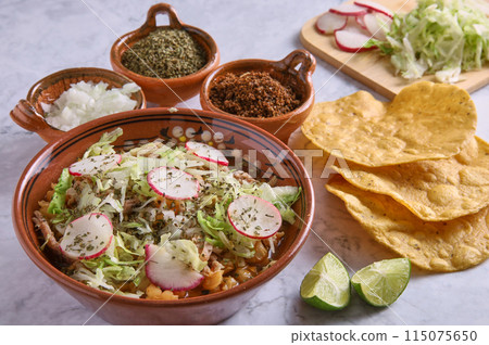 Pozole rojo, Mexican corn soup, traditional food in Mexico made with corn kernels and pork. Pozole rojo, Mexican corn soup, traditional food in Mexico made with corn kernels and pork. 115075650