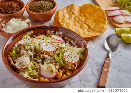 Pozole rojo, Mexican corn soup, traditional food in Mexico made with corn kernels and pork. Pozole rojo, Mexican corn soup, traditional food in Mexico made with corn kernels and pork. 115075651
