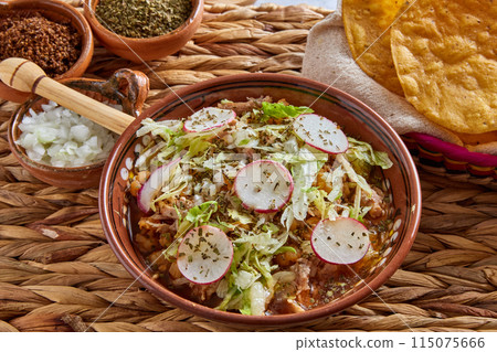 Pozole rojo, Mexican corn soup, traditional food in Mexico made with corn kernels and pork. Pozole rojo, Mexican corn soup, traditional food in Mexico made with corn kernels and pork. 115075666