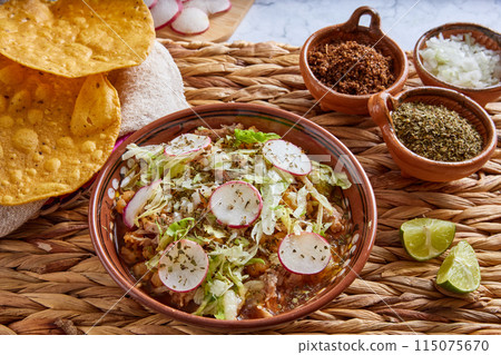 Pozole rojo, Mexican corn soup, traditional food in Mexico made with corn kernels and pork. 115075670