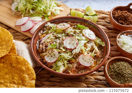 Pozole rojo, Mexican corn soup, traditional food in Mexico made with corn kernels and pork. Pozole rojo, Mexican corn soup, traditional food in Mexico made with corn kernels and pork. 115075672