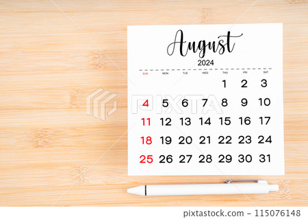August 2024 calendar page and pen on wooden background. 115076148