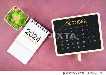 Calendar for October 2024 in black chalkboard on red background. 115076196