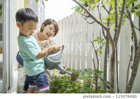 Watering plants with parents and children Watering plants with parents and children 115076480