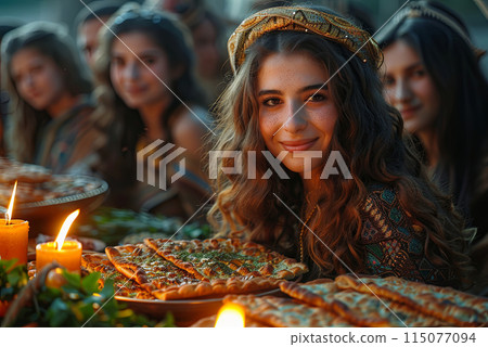 Happy Jewish woman and her family are sitting at a table to celebrate Passover Happy Jewish woman and her family are sitting at a table to celebrate Passover 115077094