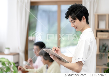 young male caregiver young male caregiver 115077823