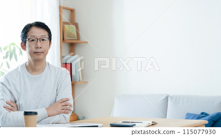 A man who is tired from teleworking 115077930