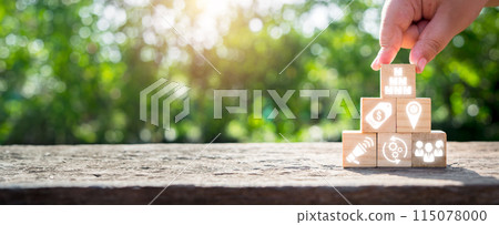 Marketing mix concept, Hand holding wooden block on desk with product, price, place, promotion, process, physical environment and people icon on virtual screen. Marketing mix concept, Hand holding wooden block on desk with product, price, place, promotion, process, physical environment and people icon on virtual screen. 115078000