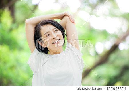 Middle-aged woman stretching 115078854