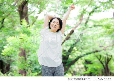 Middle-aged woman stretching 115078856