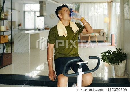 Man Hydrating After Exercise Session 115079209