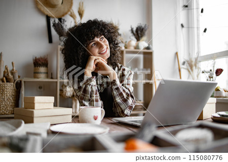 Happy female saleswoman waiting for customers. Happy female saleswoman waiting for customers. 115080776