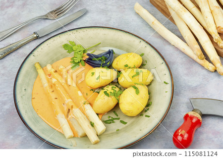 Boiled new potatoes with asparagus. 115081124