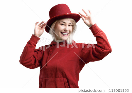 Smiling woman. Beautifu youngl woman wearing red hat and in a red sweatshirt. 115081393
