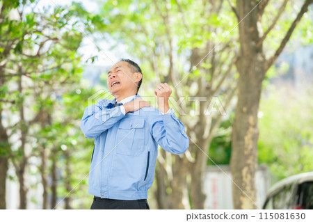 Man in work clothes stretching 115081630