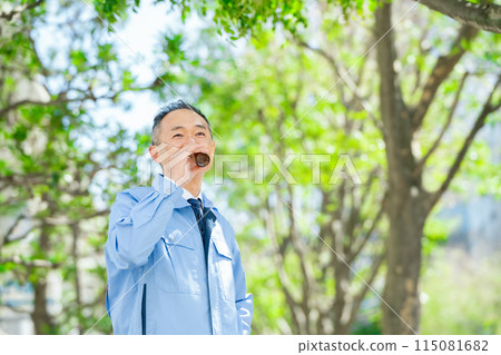 Man in work clothes Energy drink Man in work clothes Energy drink 115081682