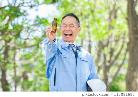 Man in work clothes Energy drink 115081695