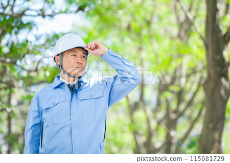 Man in work clothes, helmet 115081729