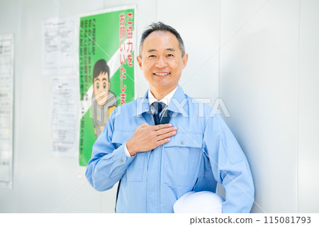 Men in work clothes, construction site, protective wall, leave it to us 115081793