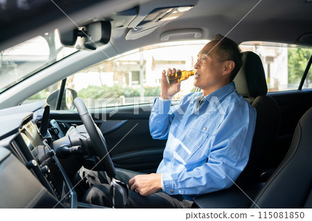 Man in work clothes, car, energy drink Man in work clothes, car, energy drink 115081850