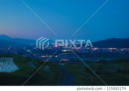 Night view of Obasute rice terraces after rice planting and Zenkoji Plain 115083174