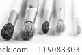 Brush set for artist on white wooden background on sunlight 115083303