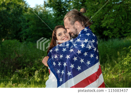 Couple with american flag. USA Independence Day Celebration 115083437