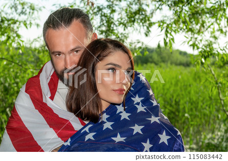 Couple with american flag. USA Independence Day Celebration Couple with american flag. USA Independence Day Celebration 115083442