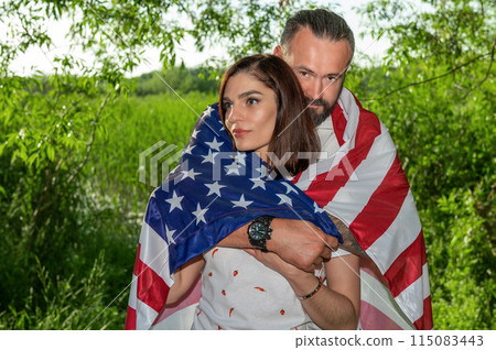 Couple with american flag. USA Independence Day Celebration Couple with american flag. USA Independence Day Celebration 115083443